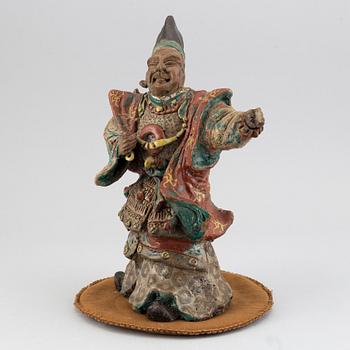 A Japanese pottery figure, 20th Century.