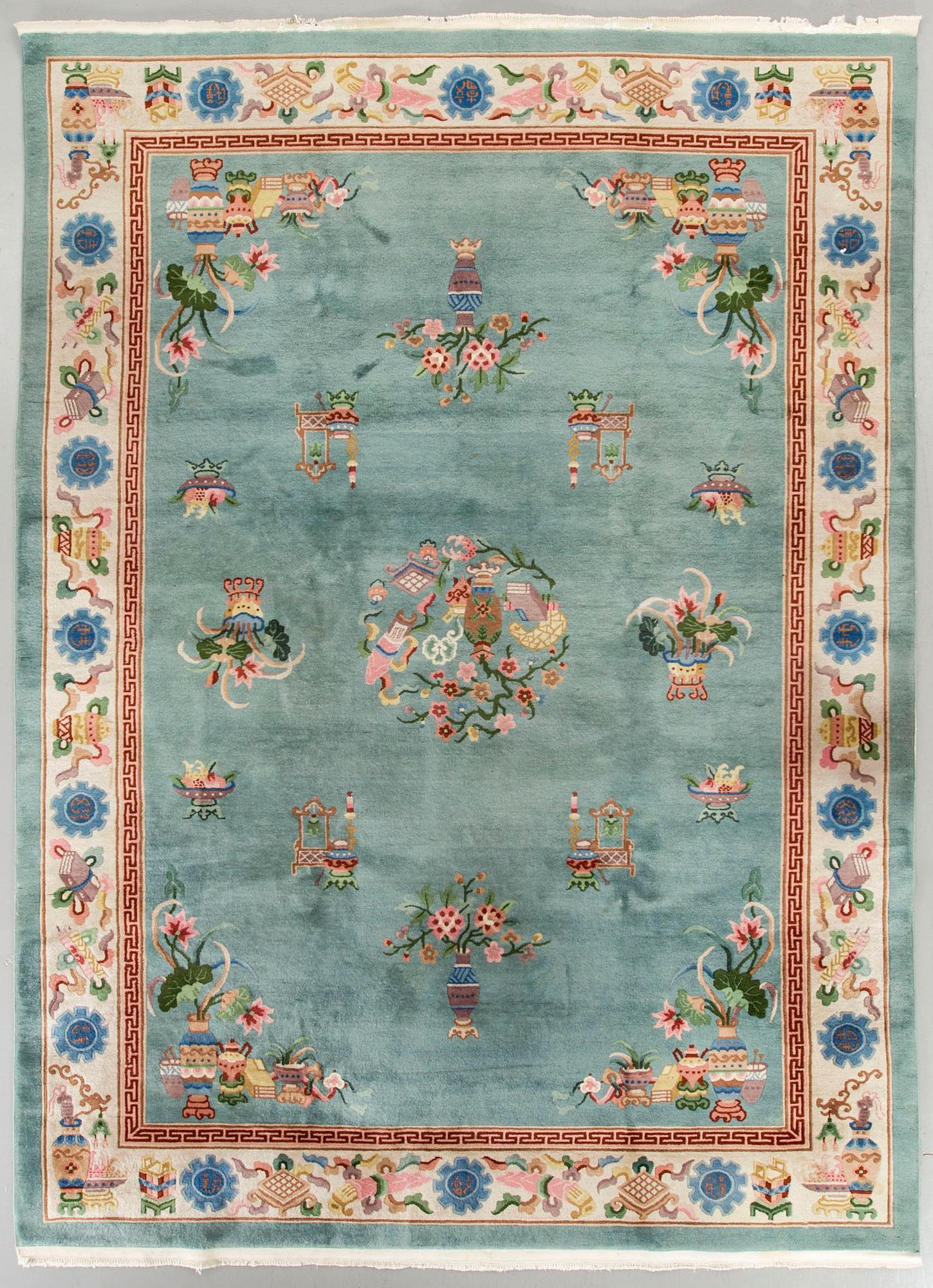 An old Chinese carpet ca 335 x 243 cm.