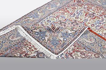 A carpet, Old Esfahan, part silk, ca 308 x 202 cm.