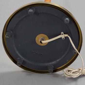 A 1960s brass and leather floor light.