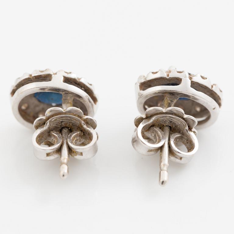 Earrings, a pair of 18K white gold set with dark sapphires and small brilliant-cut diamonds.