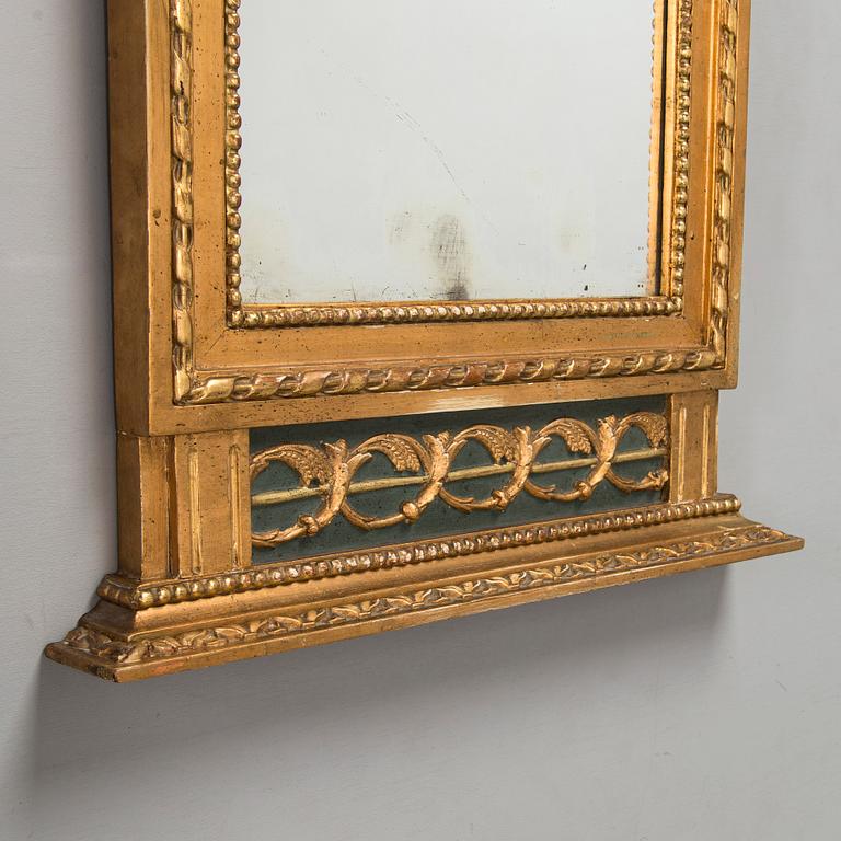 An Empire mirror, first half of the 19th century.
