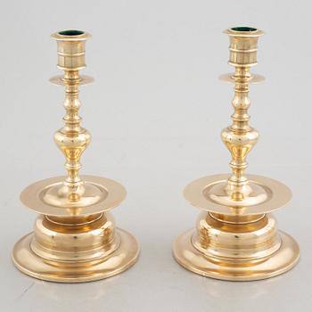 Two pairs of brass candlesticks, 19th century - early 20th century.