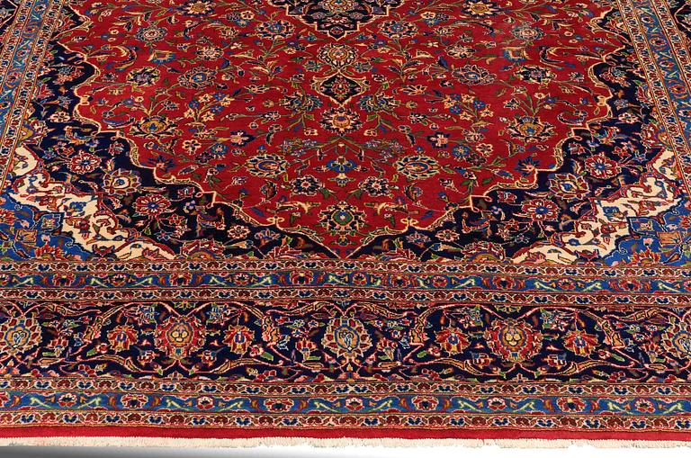 A carpet, Kashan, signed, ca 353 x 287 cm.