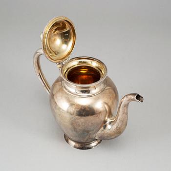 A Russian parcel-gilt silver coffee pot, unidentified makers mark, St. Petersburg 1886.