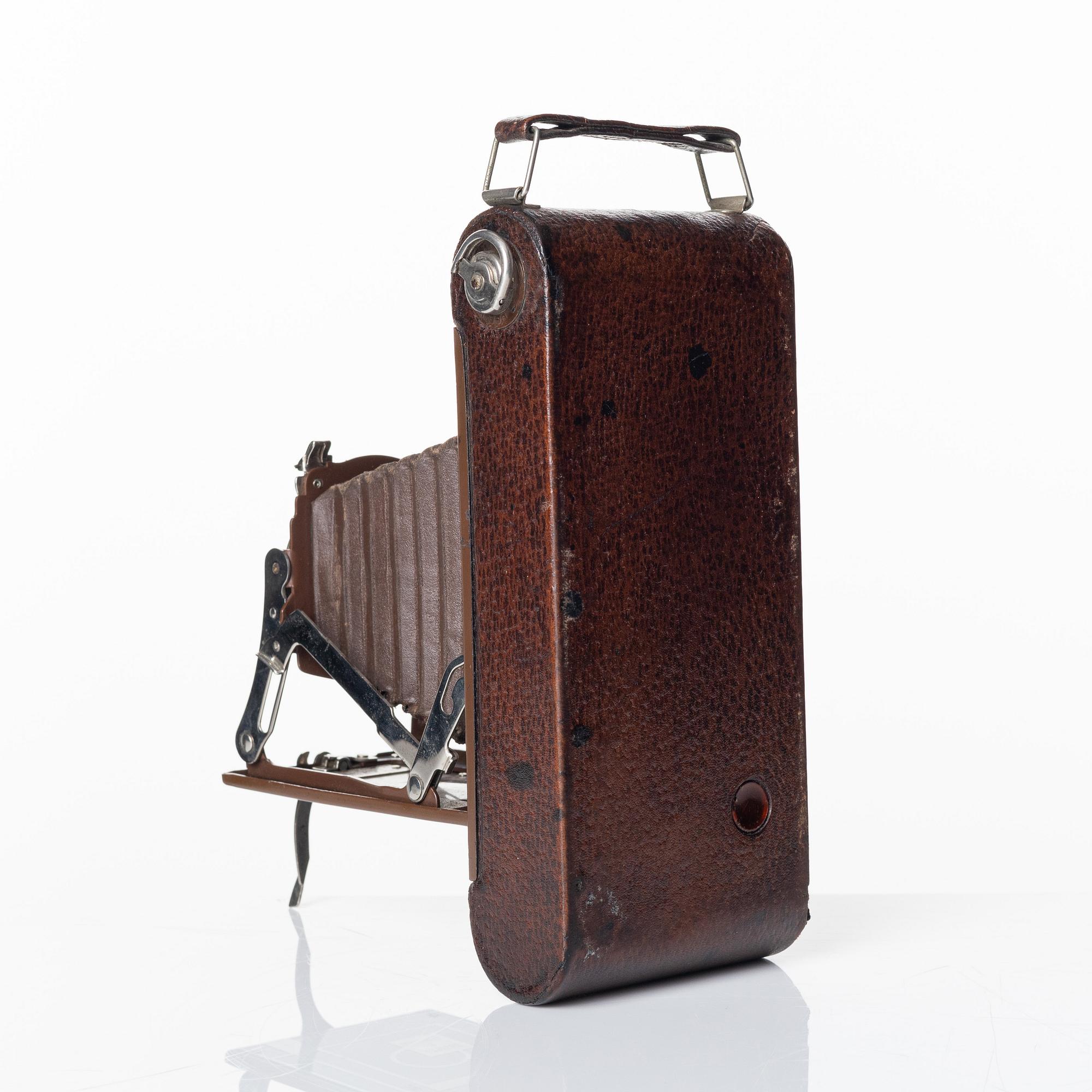 Walter Dorwin Teague, a folding camera in in a lacquered case, USA 1930s.