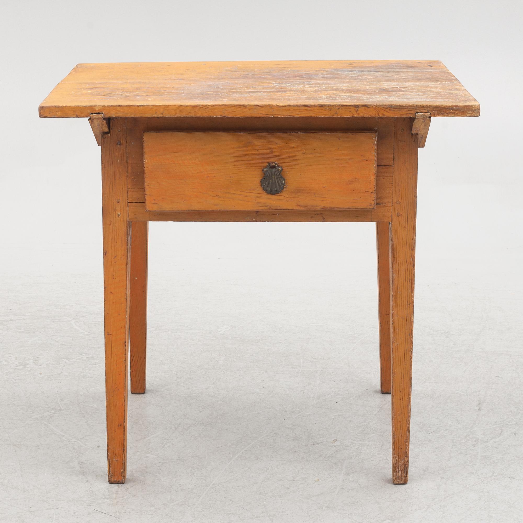 A table with drawer, 19th century.