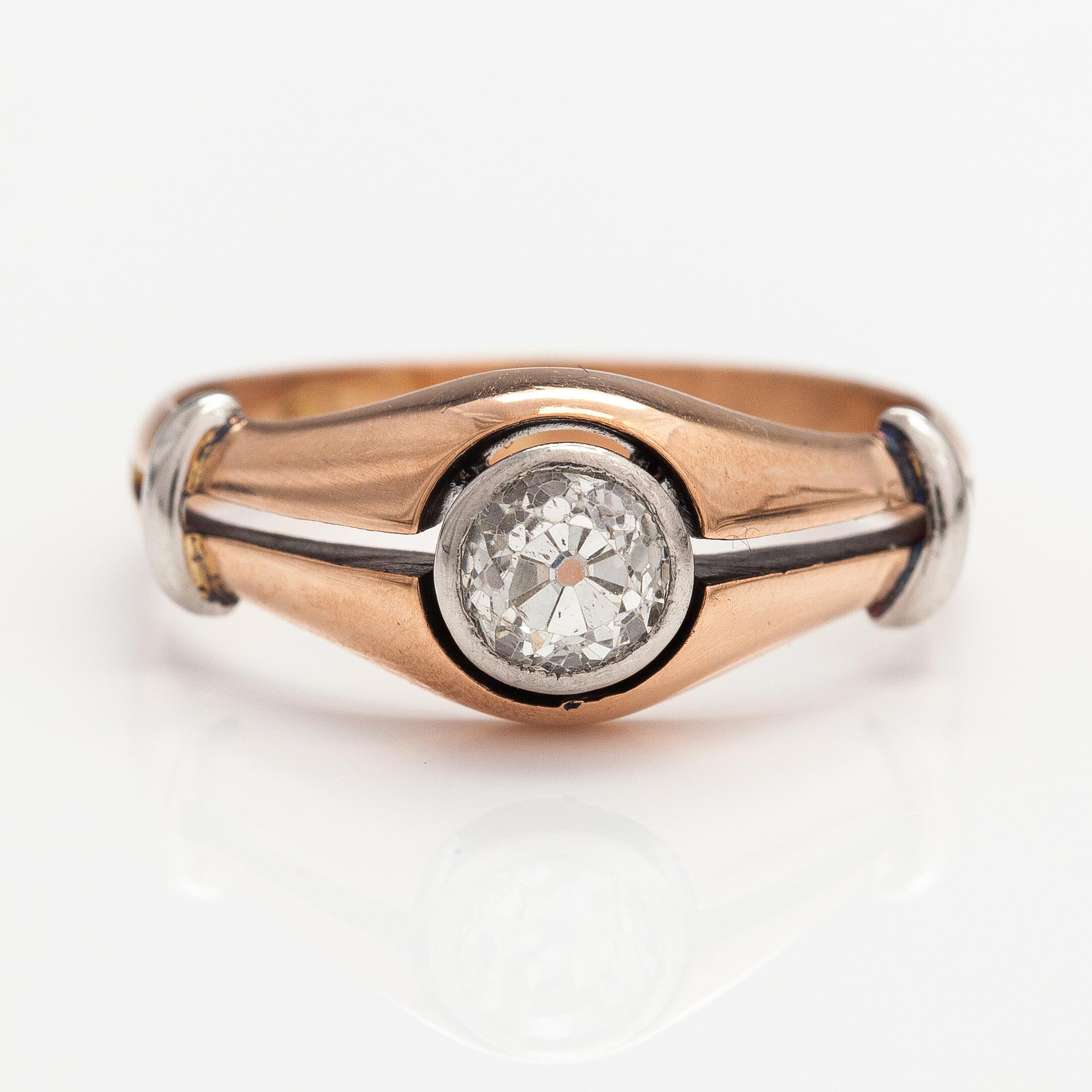 A 14K gold ring with a ca. 0.66 ct old-cut diamond.
