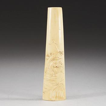 A carved ivory armrest, Qing dynasty.