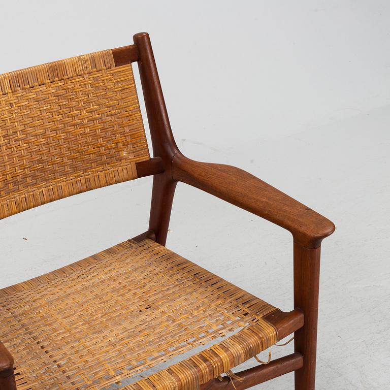 Hans J Wegner, a pair of teak and rattan "JH 516" easy chairs from Johannes Hansen, Denmark, 1950's/60's.