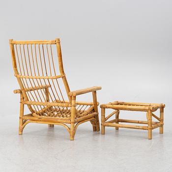 An easy chair with foot stool, end of the 20th century.
