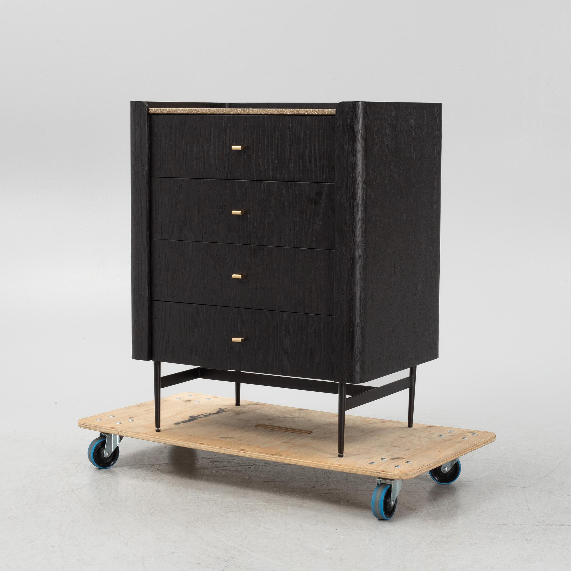 A black stained oak veneered 'Milano' dresser with top covering of faux stingray skin.