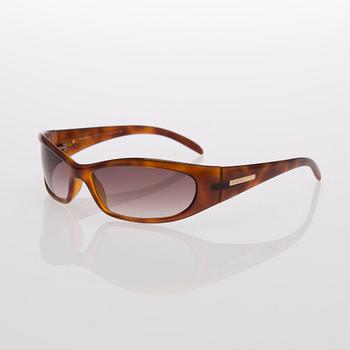 Two Pairs of Sunglasses, Prada and Chanel.