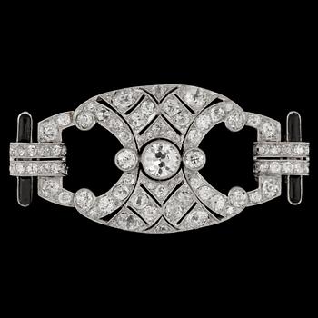 1287. A brilliant cut diamond and black enamel Art Deco brooch, tot. app. 6 cts.