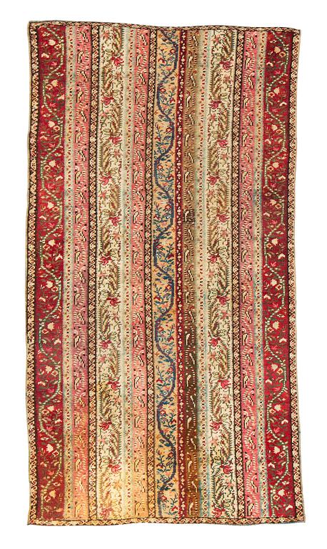 A rug, antique Gördes (Ghiordes), ca 206 x 113 cm.