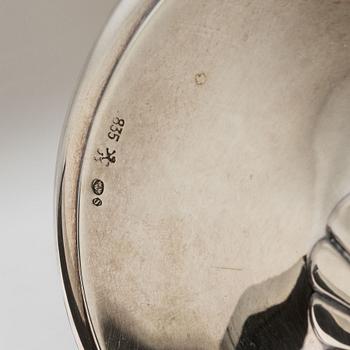 A pair of silver candle sticks, first half of the 20th century.