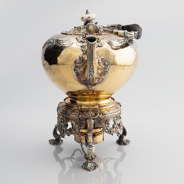 An English silver-gilt teapot with stand and burner, mark of Richard Sibley I, London 1825.