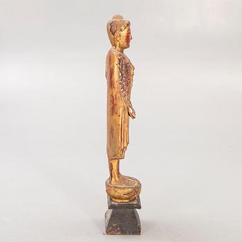 A gilde wooden Buddha first half of the 20th century.