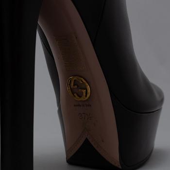 GUCCI, a pair of platform, high heel leather boots, size 37½.