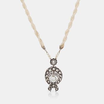 1045. A diamond and seed pearl necklace. The center taveez-cut diamond is 6.73cts.