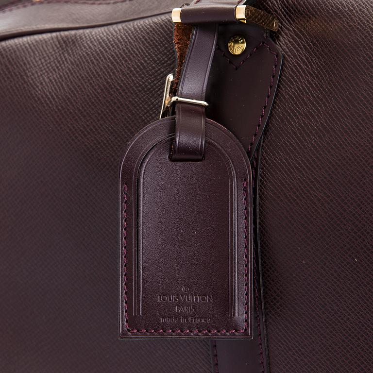 Louis Vuitton, a 'Taiga Kendall PM' weekend bag.