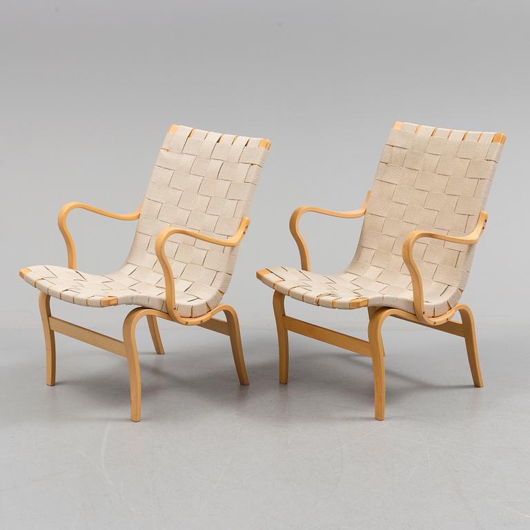 a pair of "Eva" armchairs by Bruno Matsson.