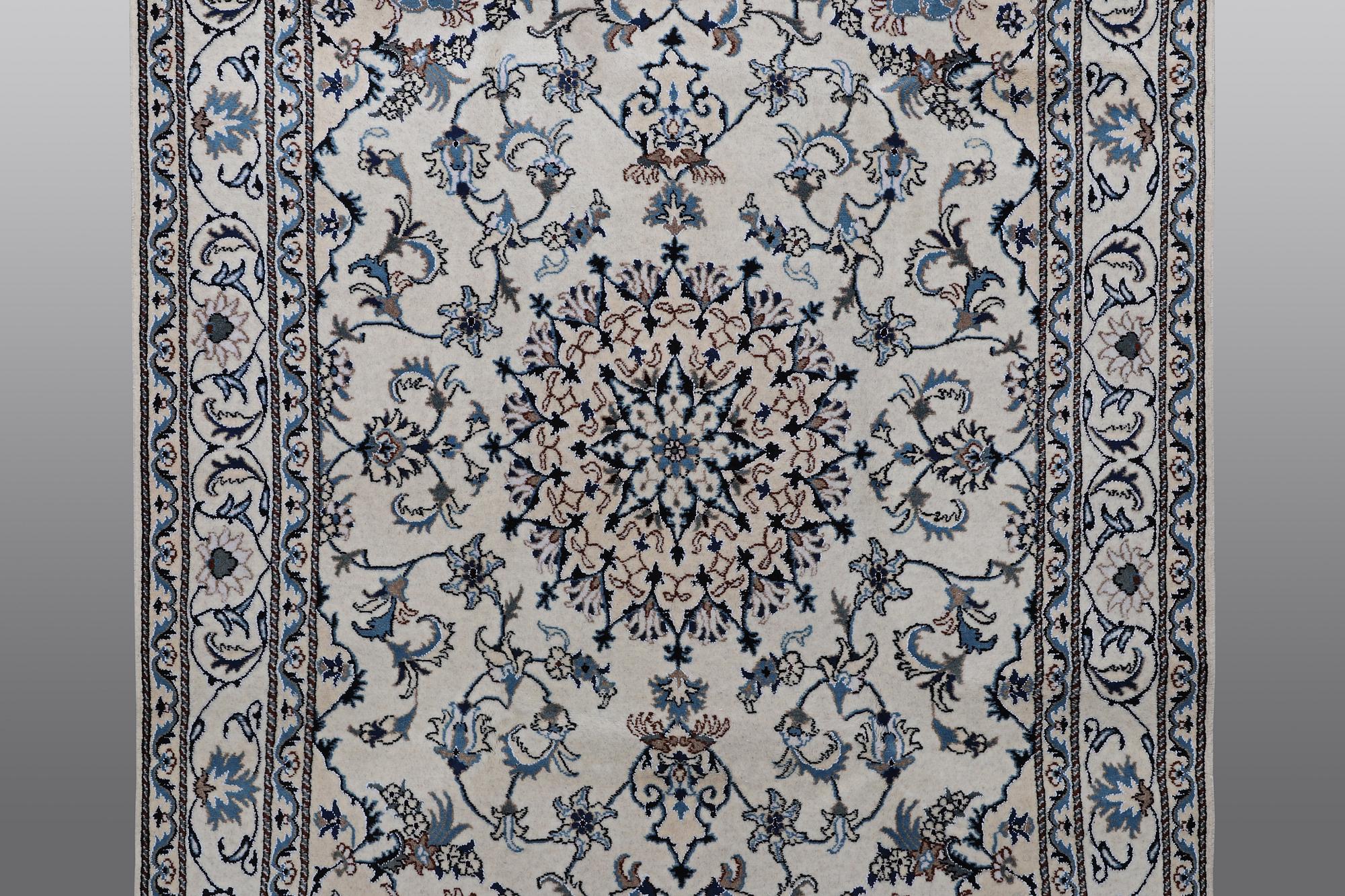A rug, Nain, part silk, 238 x 163 cm.