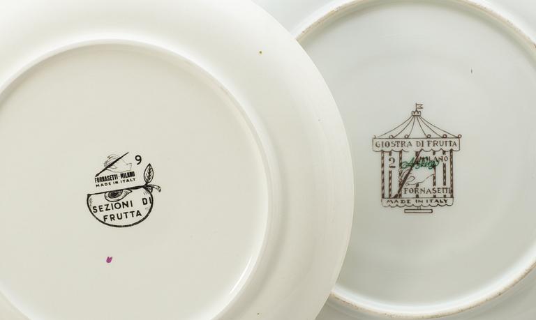 A set of nineteen Piero Fornasetti plates, Milan, Italy.
