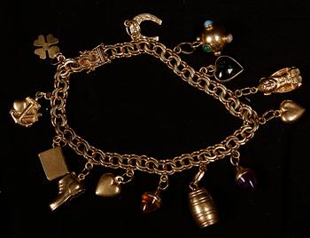 ARMBAND, 18 K guld samt halvädelstenar, Köping, 1967. Ca 22 g.