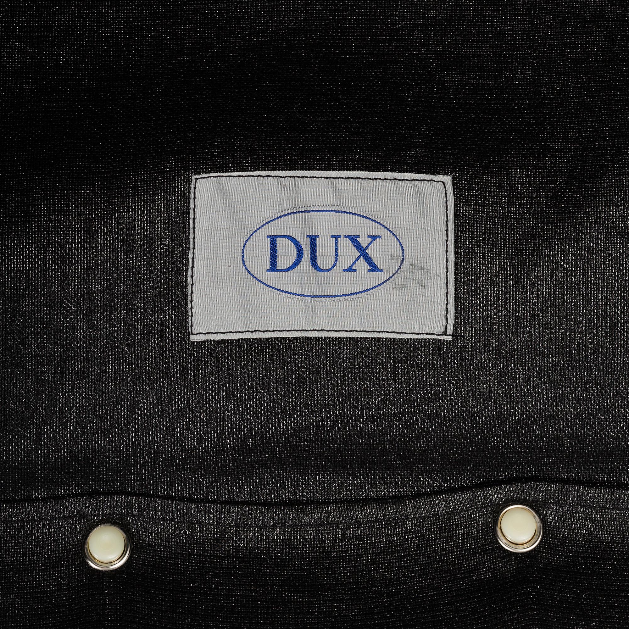 A pair of leather upholstered easy chairs from Dux, late 20th Century.