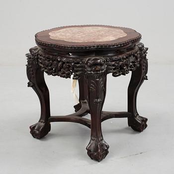 A Chinese hardwood table with marble top, 20th Century.