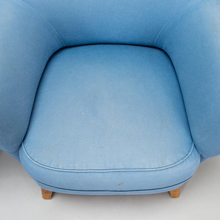A pair of mid-20th-century armchairs.