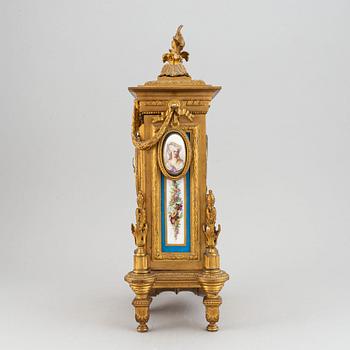 A late 19th century table clock and candelabra, probably France.