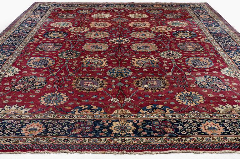 A fine Meshed carpet of 'Vase' design, North-East Persia, c. 480 x 345 cm.