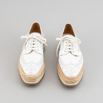 Prada, a pair of white leather brogues, size 36.
