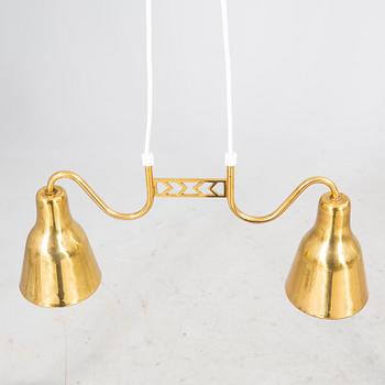 Taklampa 1900-talets mitt.