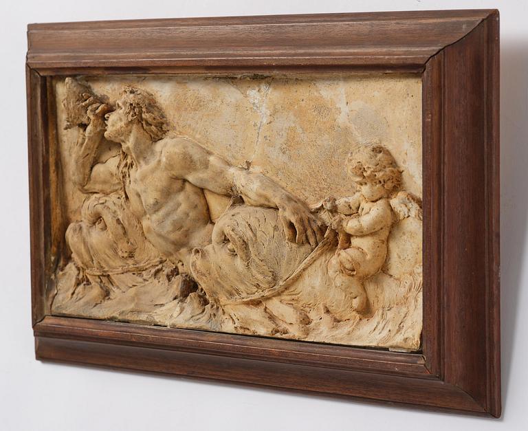 Claude Michel Clodion, attributed to, A relief depicting a nereid riding a dolphin alongside a triton blowing into a conch.