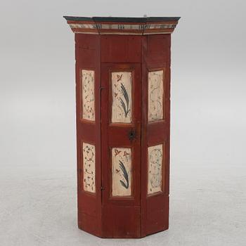 A painted corner cabinet, 19th century.