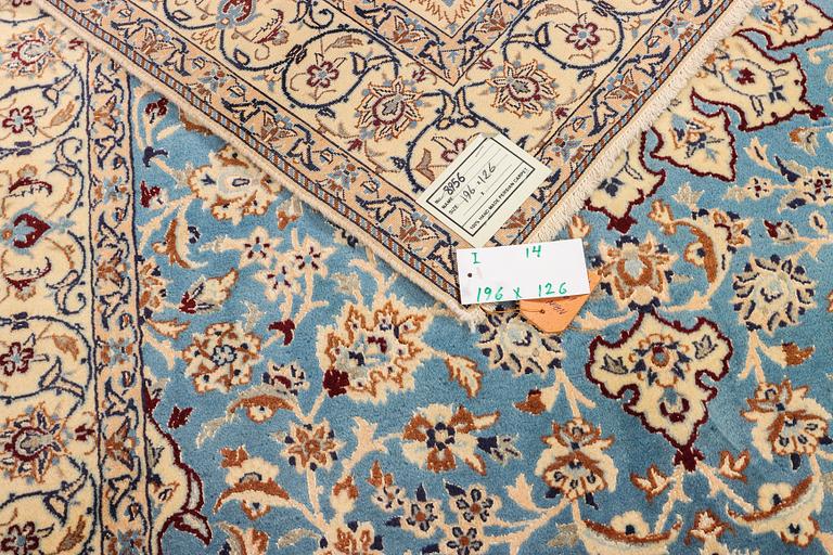 A Nain, part silk carpet, c. 196 x 120 cm.