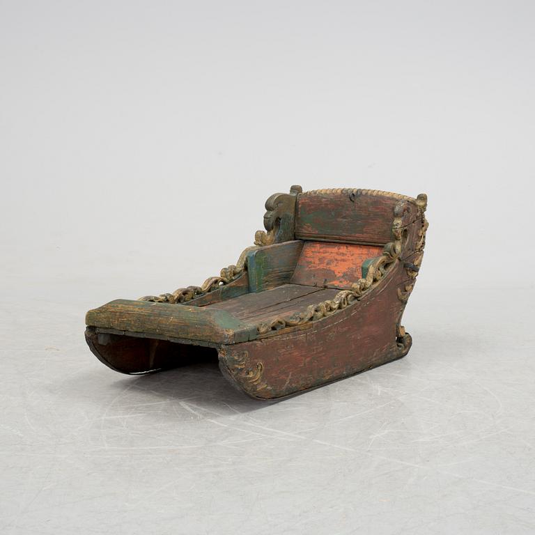 A childrens sleigh middle european dated 1709.