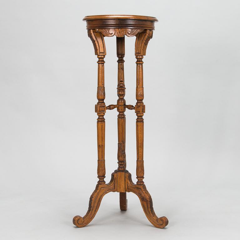 A carved wooden pedestal, late 19th century.