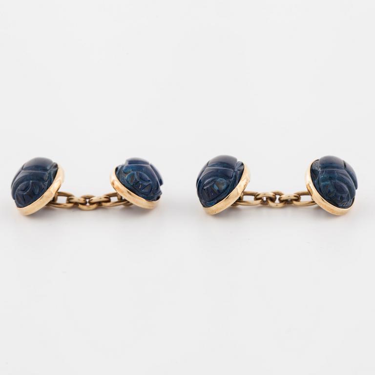 A pair of carved lapis lazuli cufflinks.