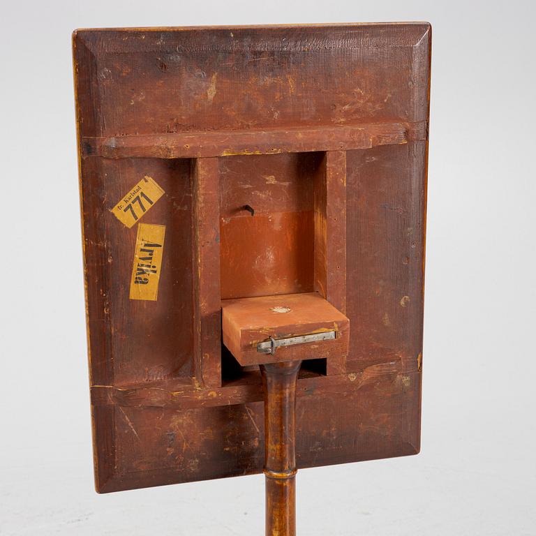 A drop-leaf table, 19th Century.