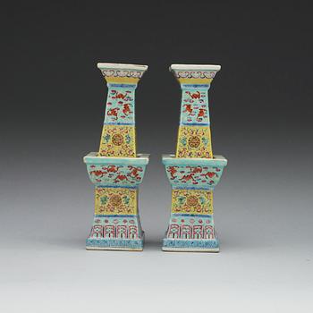 A pair of famille rose altarsticks, late Qing dynasty.