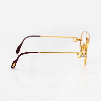 must de Cartier, Santos, a pair of eyeglass frames. Marked Cartier, Paris, Made in France 135, 56, 16.