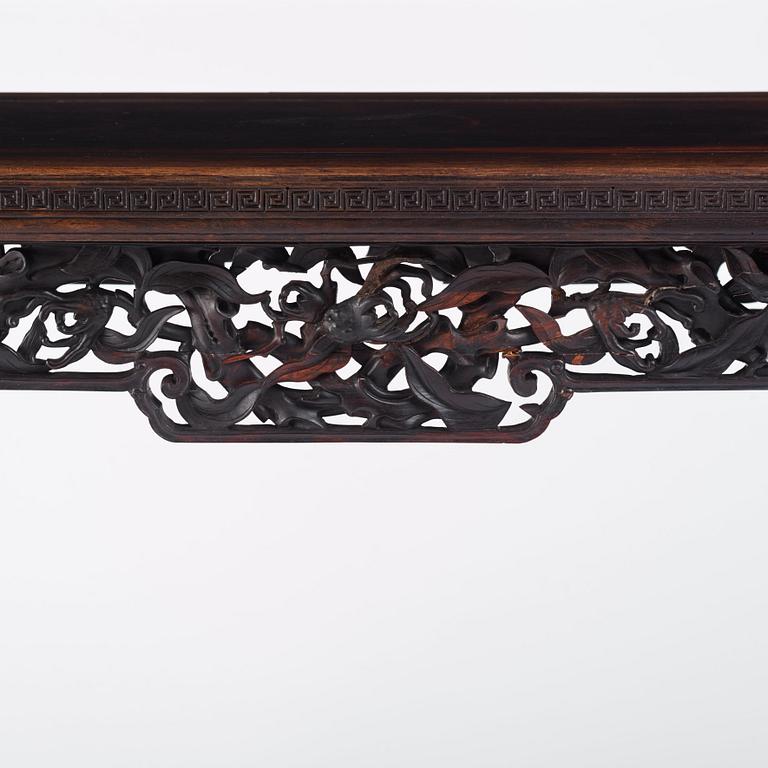 A massive zitan recessed-leg long table 'Jiaotousun Qiotouan', Qing dynasty, 19th century.