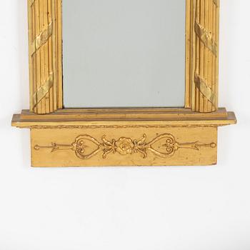 A giltwood Empire mirror by J. P. Holmberg (active in Stockholm 1813 - 1831).