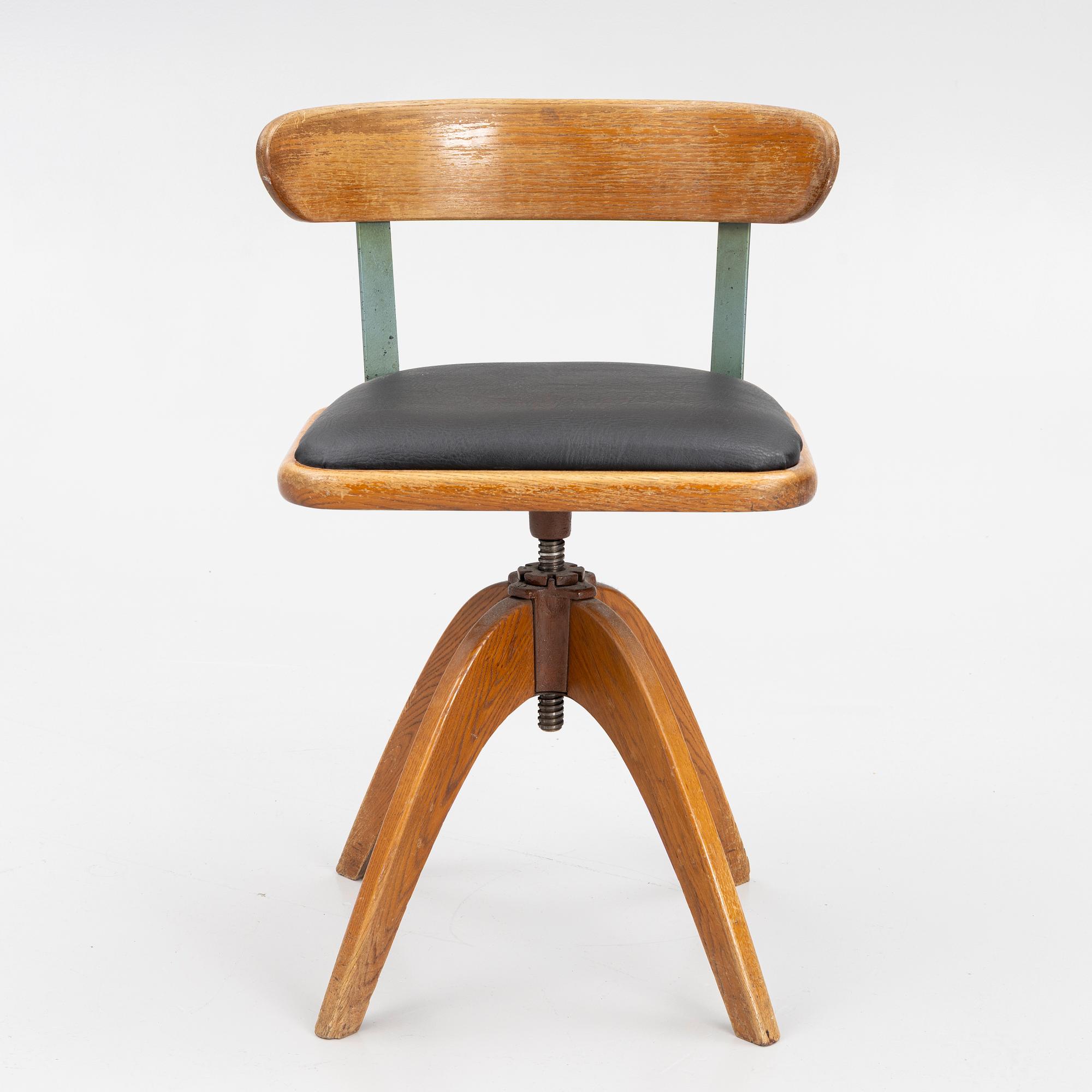 A 1920's swivel desk chair.