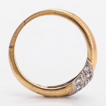 Cartier, an 18K gold ring with diamonds.