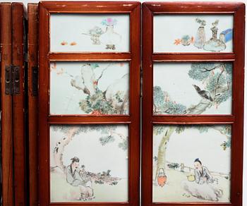 A Chinese folding screen with 48 porcelain tiles, late Qing dynasty, signed Ren Huanzhang, and dated 1881.